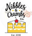 Logo of Nibbles & Crumbs Co. with a slice of cake and cherry on top.